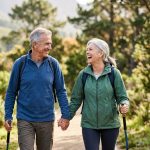 An image of a happy couple, in an outdoor activity, moving well