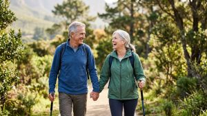 An image of a happy couple, in an outdoor activity, moving well